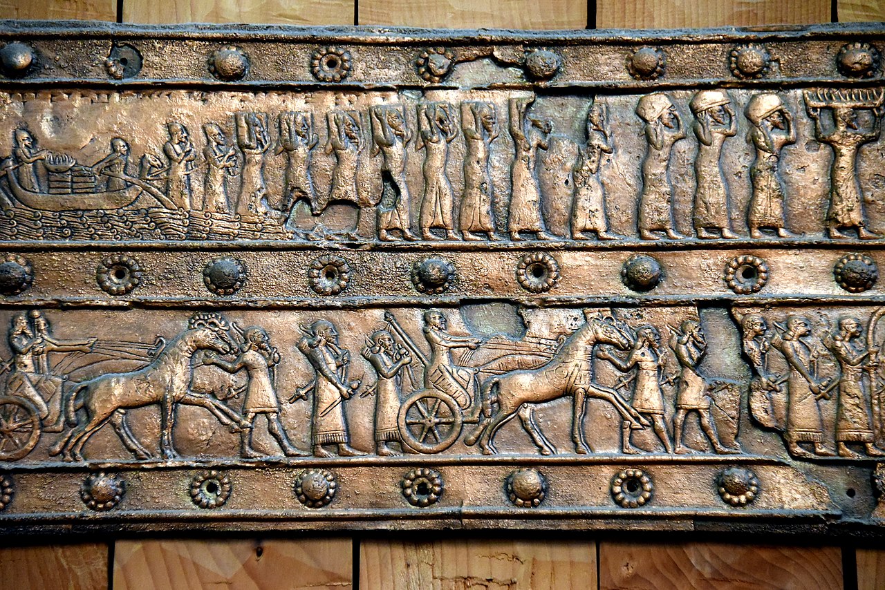 1280px-Balawat_gate_of_Shalmaneser,_bronze_stripe,_detail,_9th_century_BCE.jpg