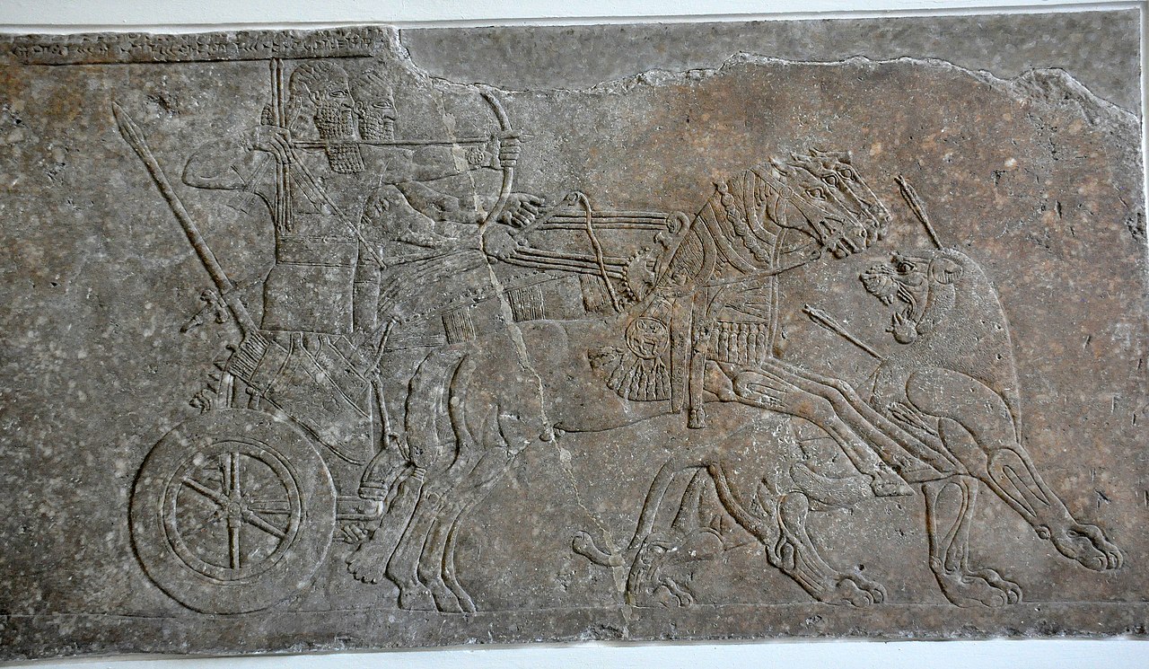 1280px-Lion-hunting_scene_of_Ashurnasirpal_II_from_his_palace_a.jpg