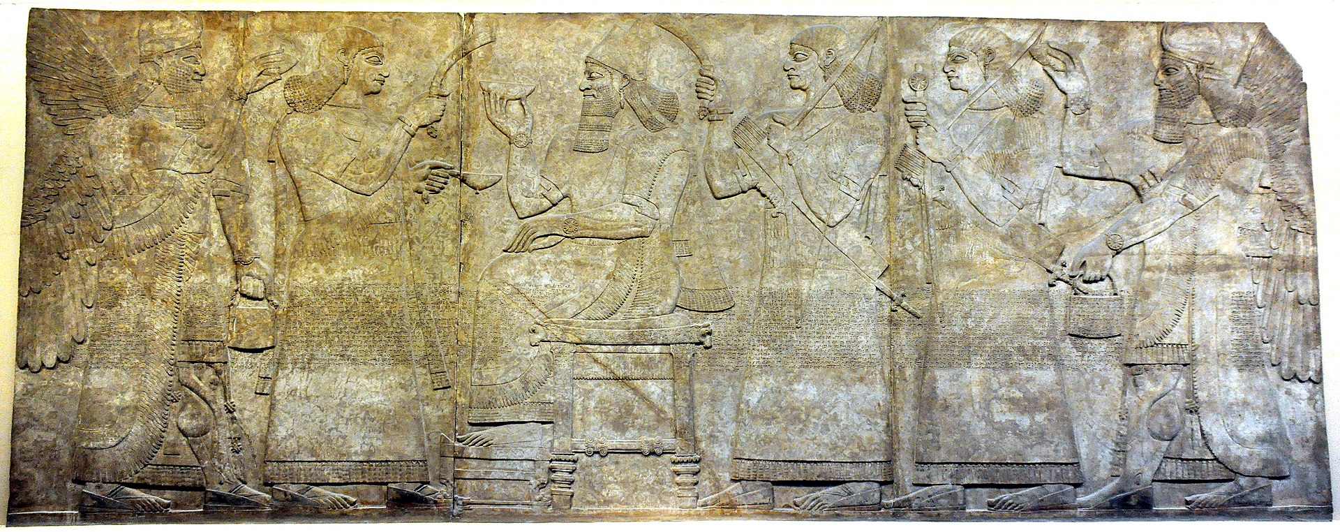 1920px-Ashurnasirpal_II,_2_royal_attendants,_and_2_.jpg
