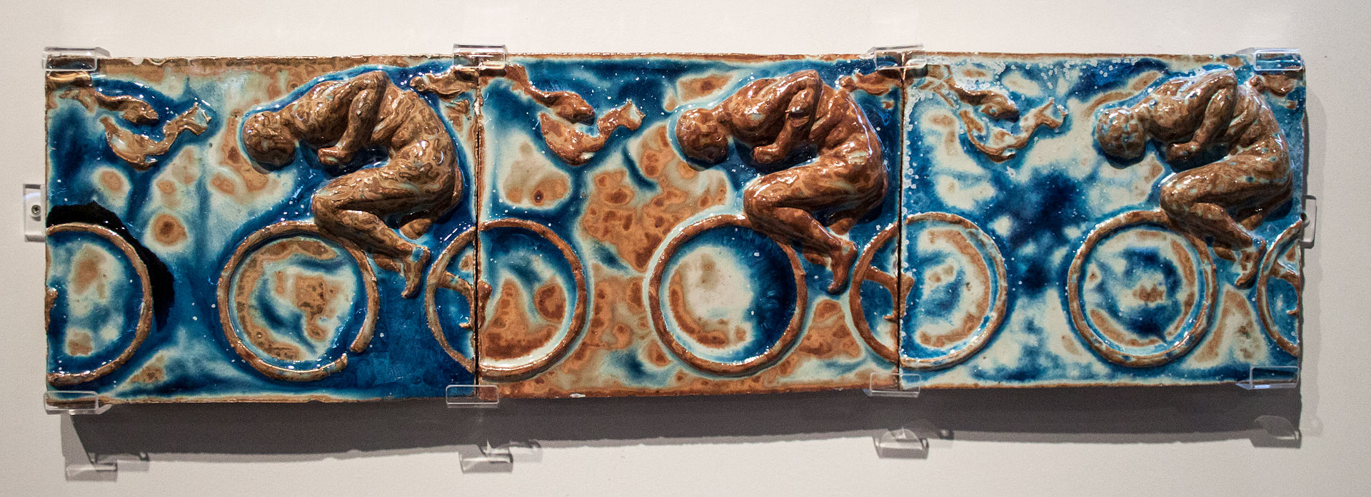 1920px-Bigot_-_Pierre_Roche_-_Cyclists,_Frieze.jpg