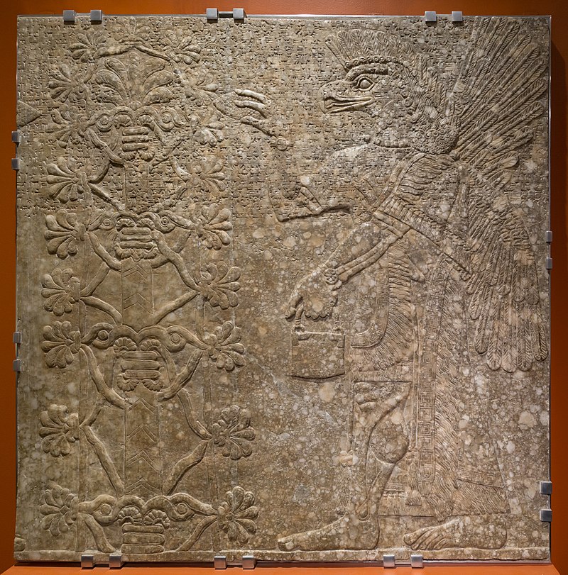 800px-MJK46842_Genie_Before_the_Sacred_Tree_(Ashurnasirpal_II).jpg
