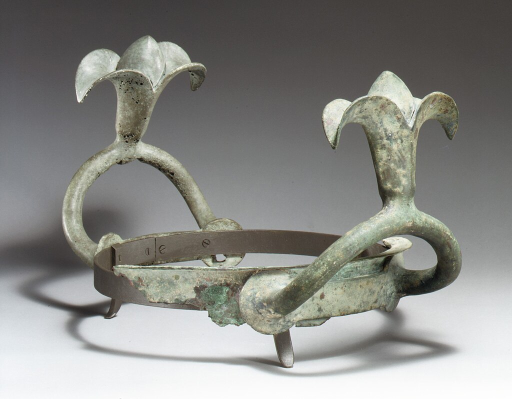 Bronze_handles_and_part_of_the_rim_of_a_cauldron_MET_GR267.jpg