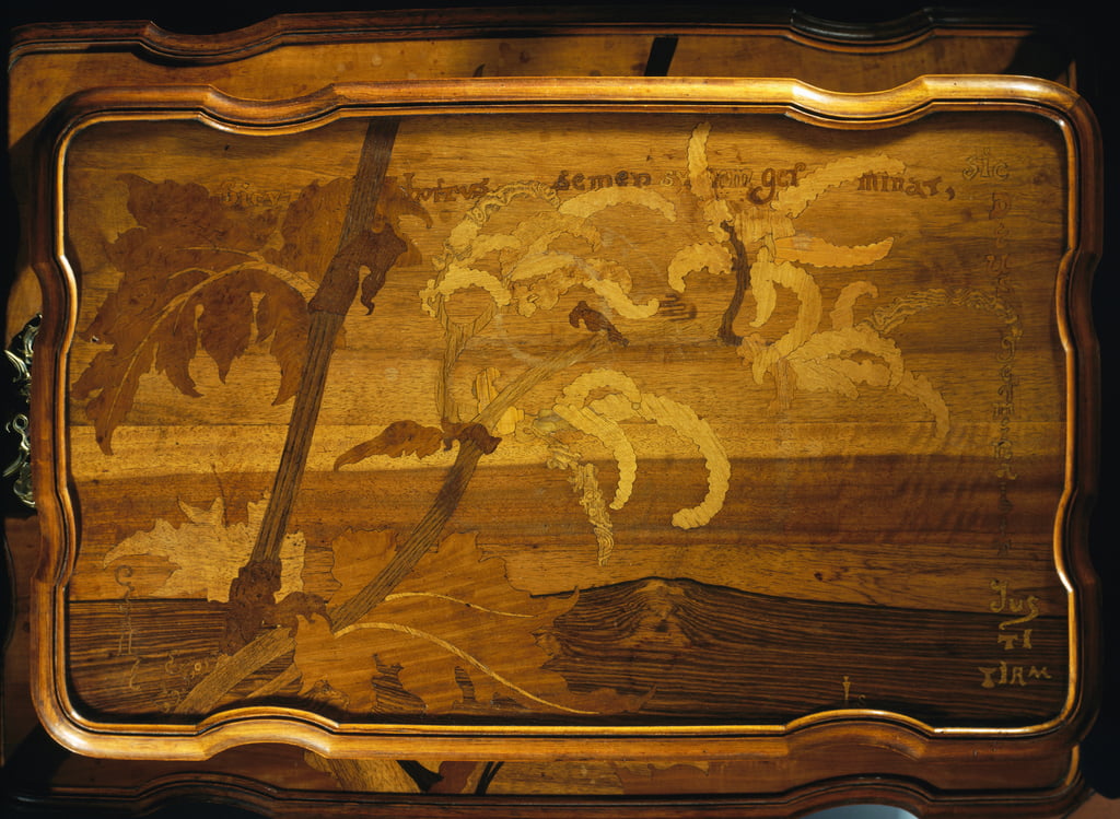 Emile_Galle_-_Palm_trees_by_sea_inlaid_wooden_table_top_by_Emile_Galle_(1846-1904).jpg